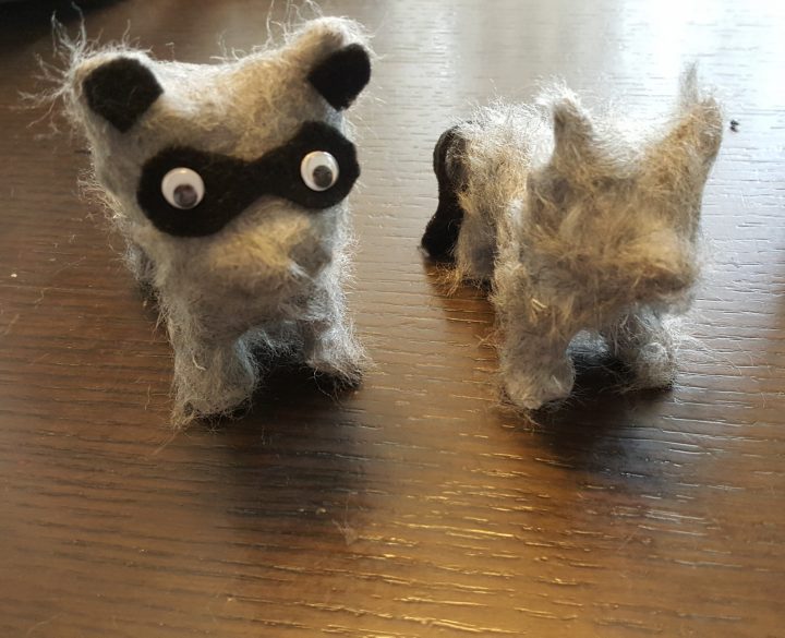 clay animals shows fuzzy racoon figures.