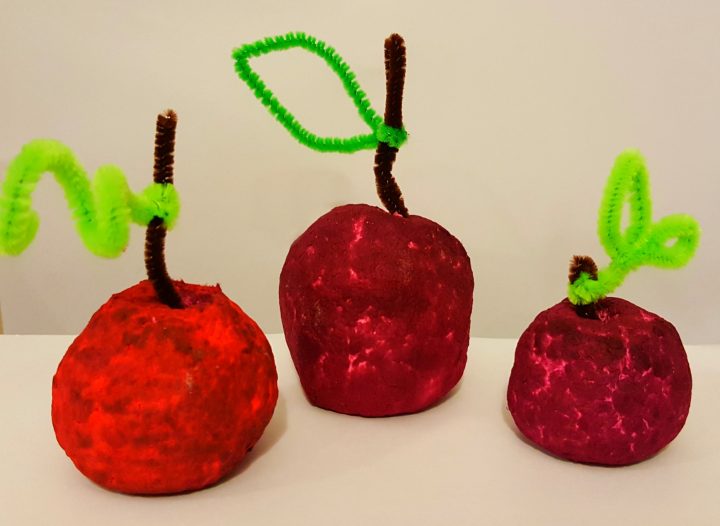 craft ideas for kids shows three apples made from recycled paper.