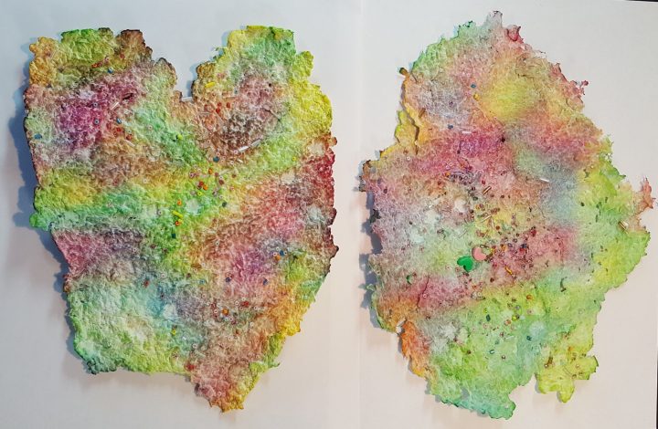 recycled crafts shows two pieces of recycled paper that are colorful.