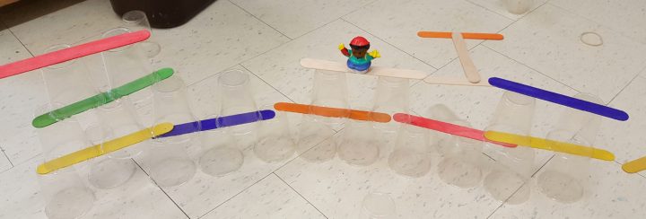 stem challenge shows a long tower made from cups and popsicle sticks.