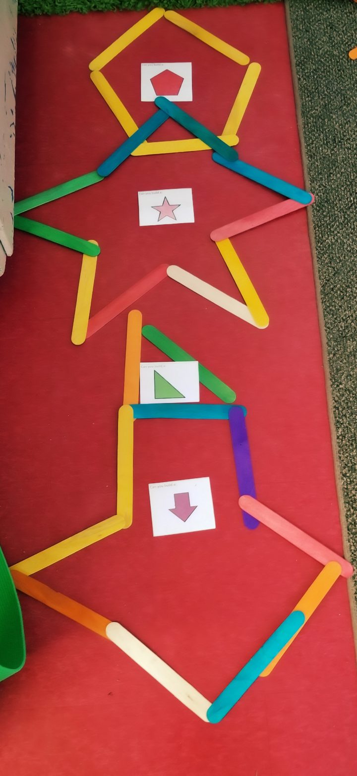 math activities for preschool and kindergarten shows shapes made from popsicle sticks.