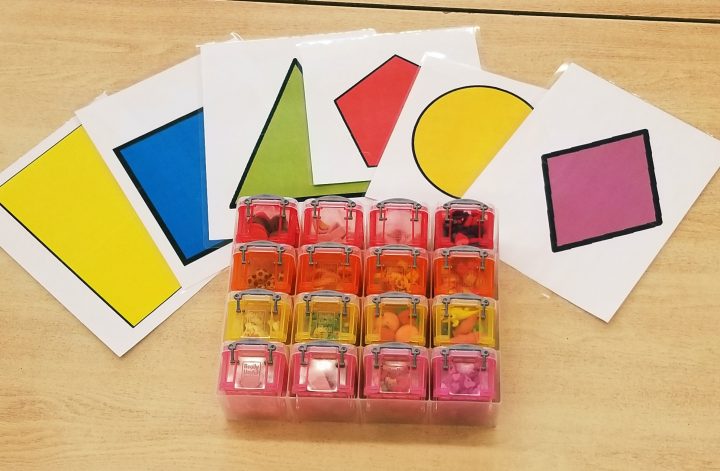 math activities for preschool and kindergarten shows large shape cards and a container with mini erasers.