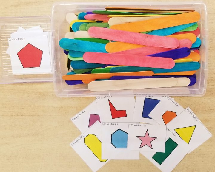 math activities for preschool and kindergarten shows a bin of popsicle sticks and cut out shape cards.