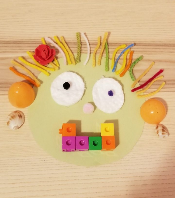 art activity for kids shows a face made from random everyday objects.
