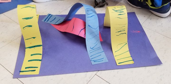 STEM activity shows a colorful roller coaster made from construction paper.