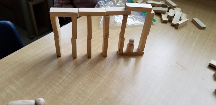 stem shows a structure made from wooden blocks.