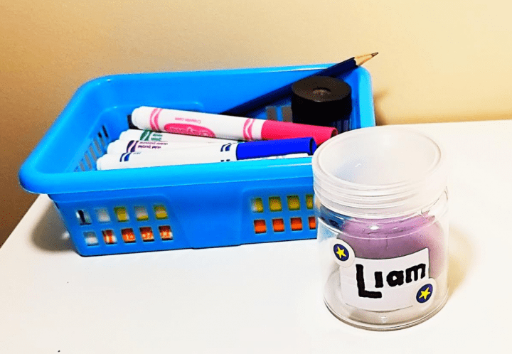 back to school activity shows a jar with playdough and a basket with markers.