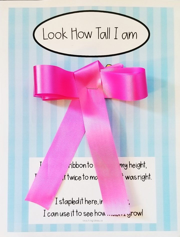 time capsule ideas shows a sheet with a pink bow that says look how tall I am.