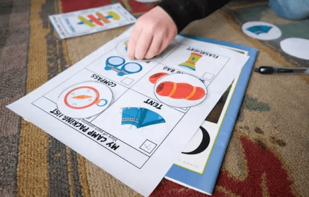 learning activity shows a child matching images on a printable page.