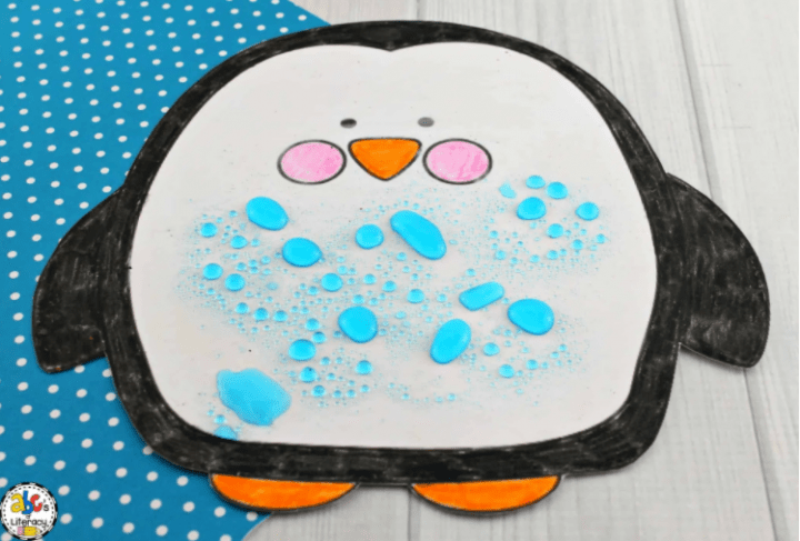 science experiments for kids shows a penguin with water beaded on top.