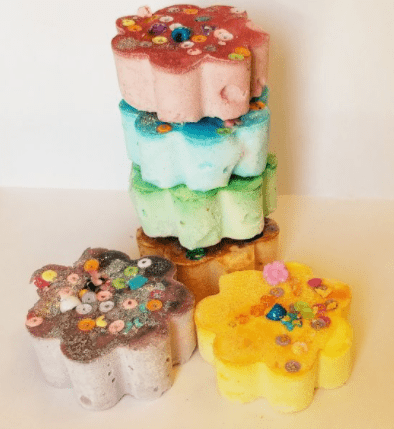 science experiment for kids shows pastel tower of flower pucks