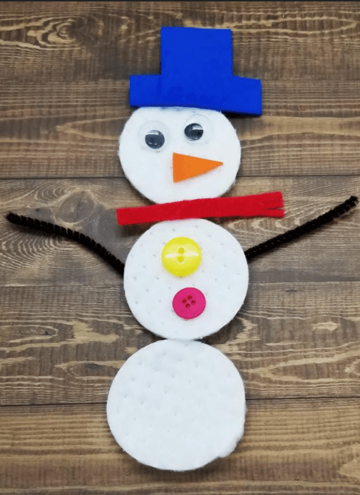 free roll a snowman shows a snowman made from cotton swabs, buttons set.