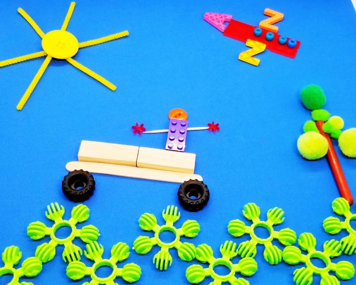 object art for kids shows a picture made from random objects, like pompoms, wooden blocks, pencils etc.