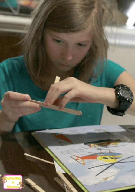 STEM ideas shows a child building an airplane.