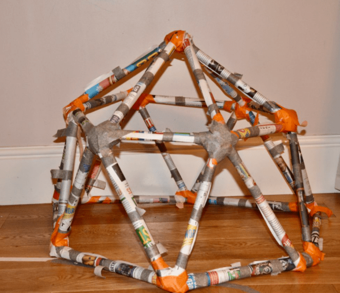 STEM challenges shows a cage made from newspaper.