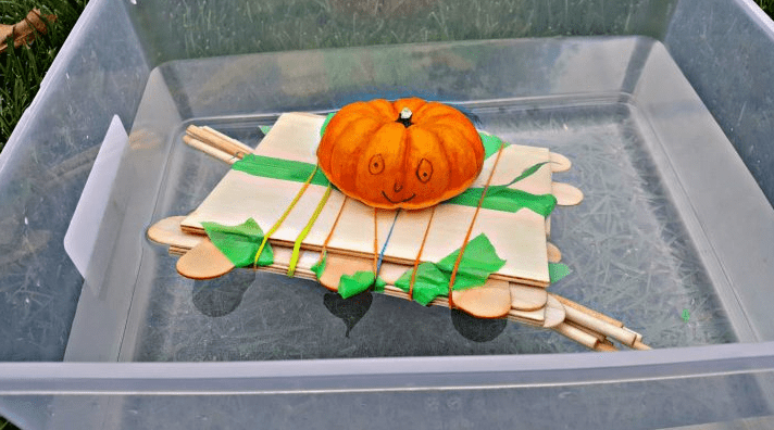STEM challenges shows a pumpkin on a popsicle stick boat.