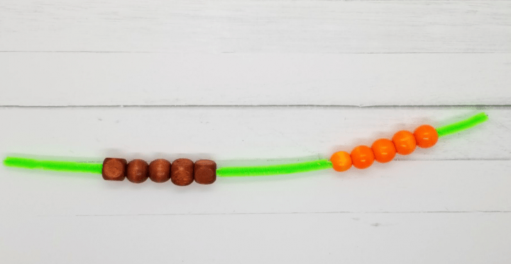 number talks shows a pipe cleaner with ten beads on it.