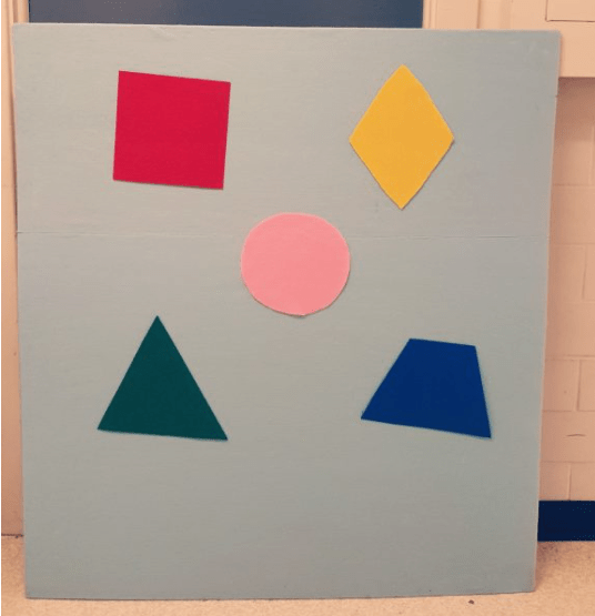 diy felt board shows a huge board with five felt shape pieces stuck to it.