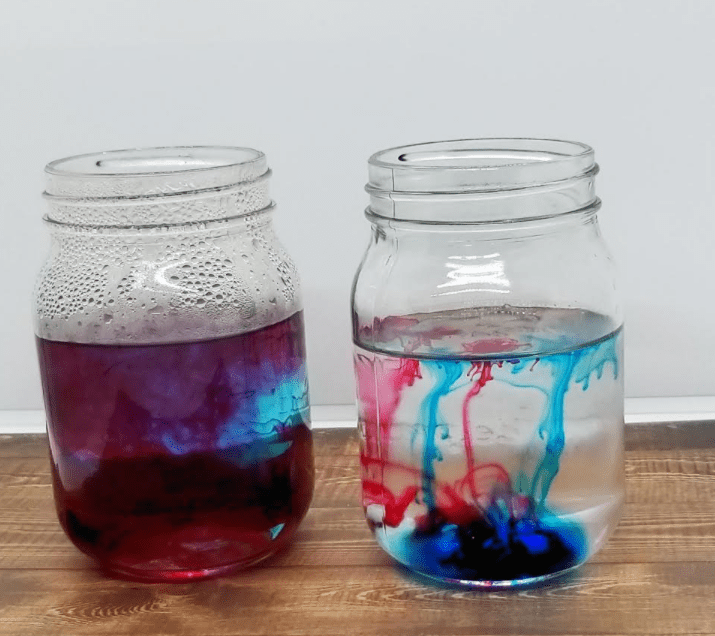 properties of water shows two jars with color swirling through them.