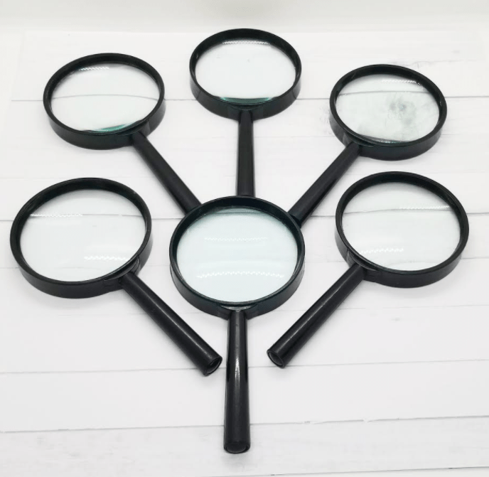 school supplies shows six magnifying glasses.