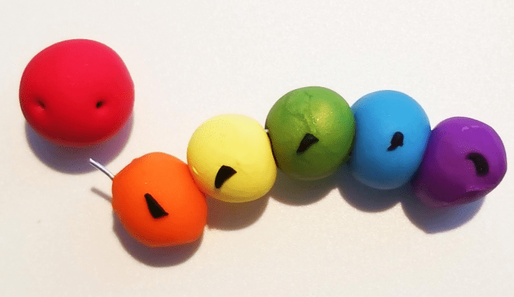 easy clay shows the colorful balls of a caterpillar.