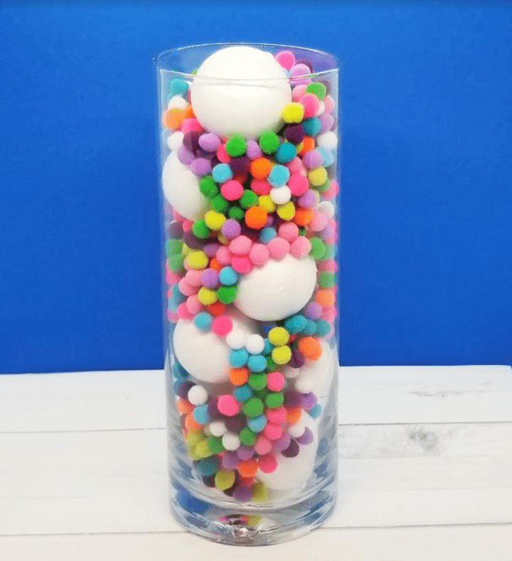 mental health lesson shows a clear jar with Styrofoam balls and pompoms.