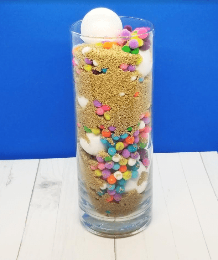 mental health shows a jar with sand, balls and pompoms.
