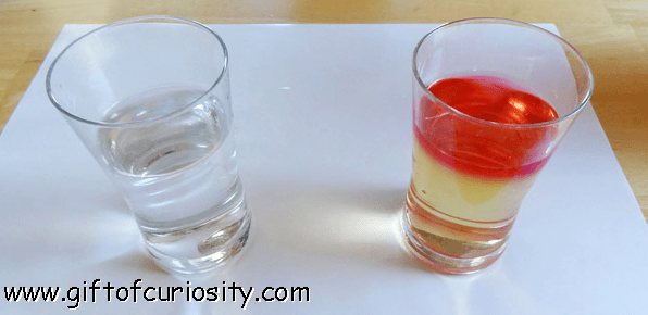 science experiments for kids shows two cups. One with water the other with yellow layer and red layer.