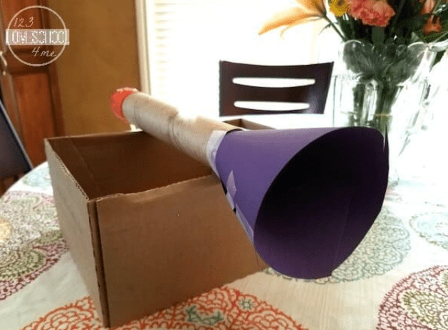 science experiments for kids shows a horn shaped item made from cardboard.