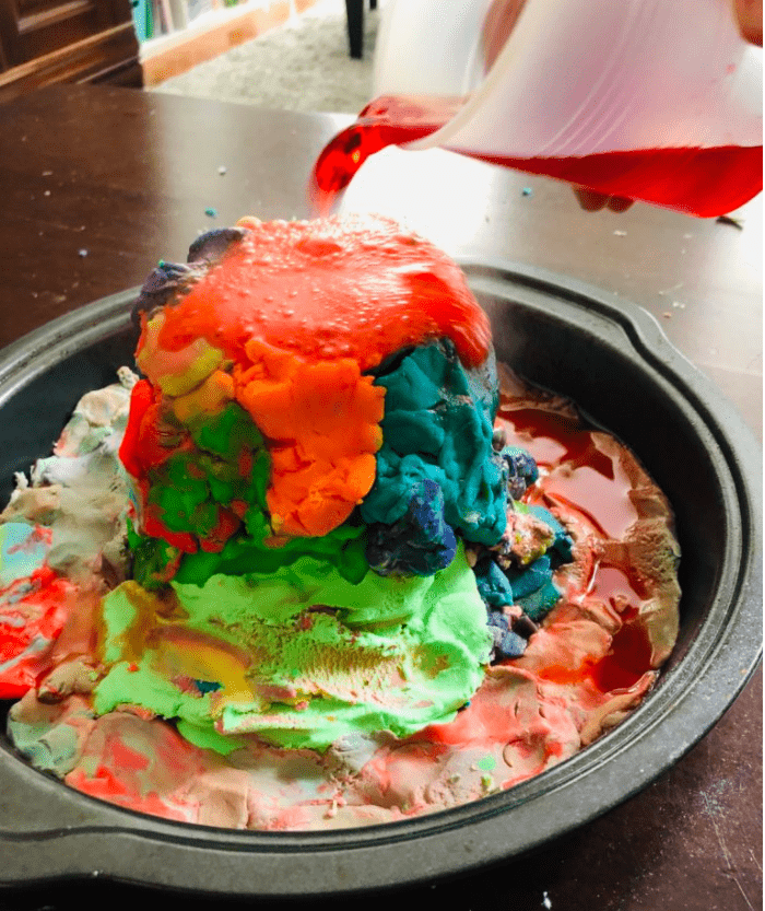 science experiments for kids shows a play dough volcano.