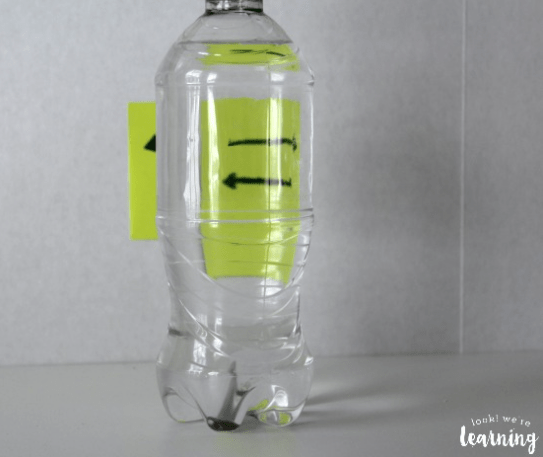 stem for kids shows a bottle with water and arrows pointing in opposite directions.