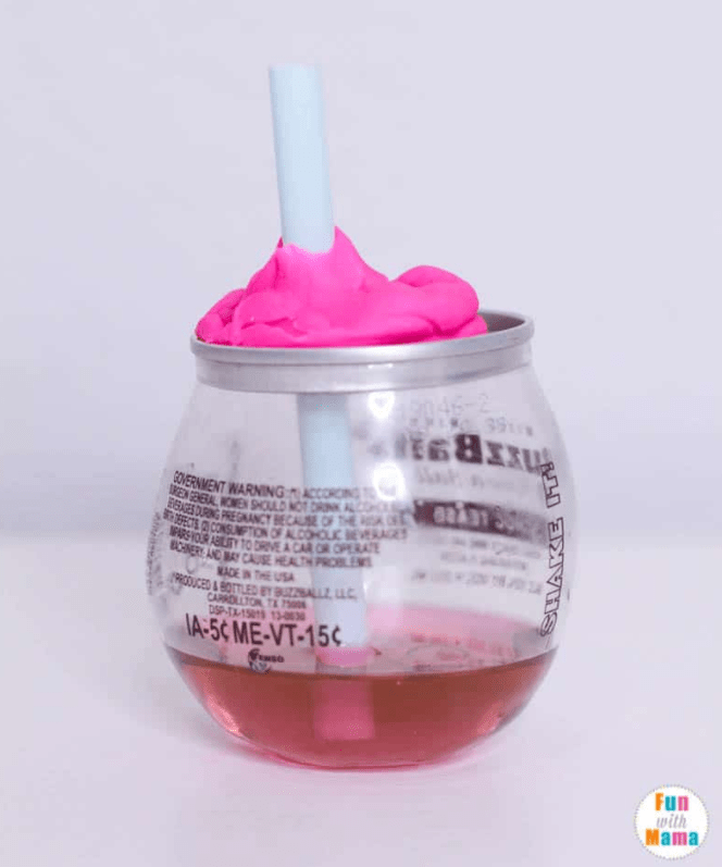 science experiments for kids shows a jar with pink liquid and a straw in it.