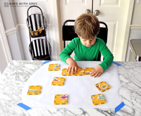 puzzles for kids shows a child putting together a puzzle.
