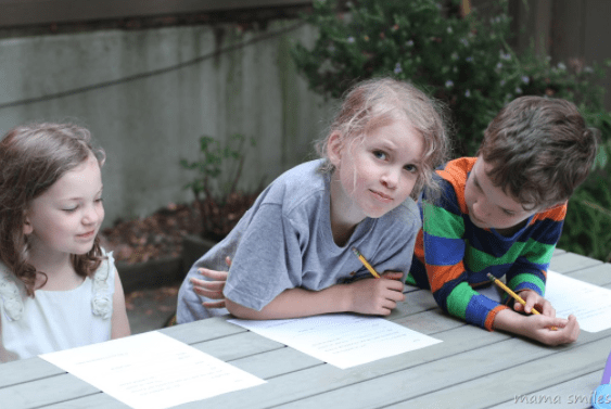 first day of school shows children writing letters.