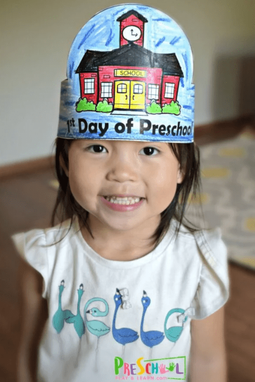 first day of school hats shows a child wearing a hat that says first day of preschool.