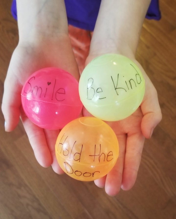 Back to School - A picture of 3 colored ball pit balls. Each ball has a kind saying on it, such as "smile, be kind and hold the door."