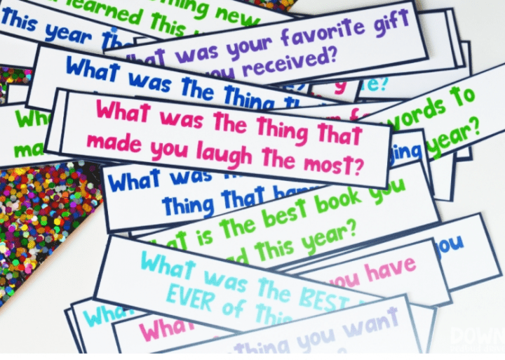 new years eve party ideas with colorful sentence strips of questions about the past year.