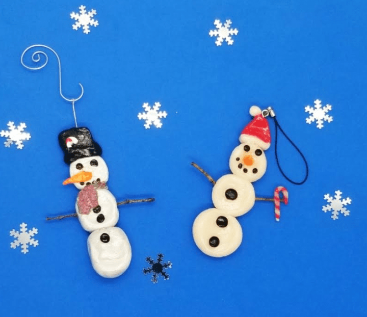 clay crafts shows two snowmen ornaments.