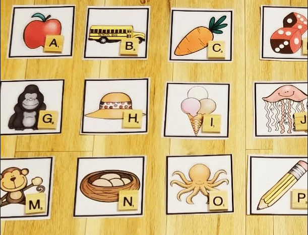 phonemic awareness shows picture cards with wooden letters in the corners