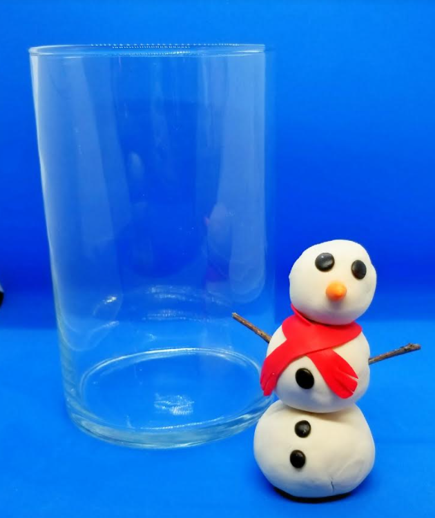 stem challenge and a picture of a snowman beside a class jar