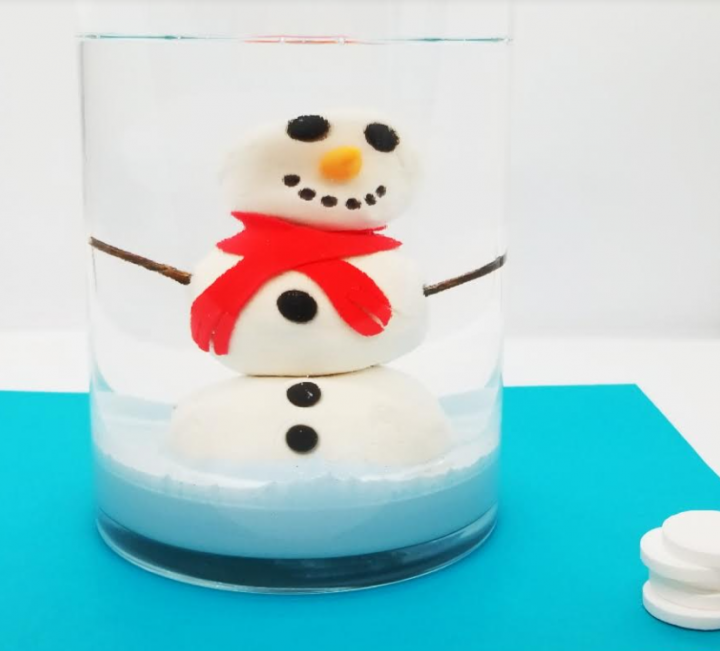stem challenges including a snowman in a container filled with oil for a stem activity for kids