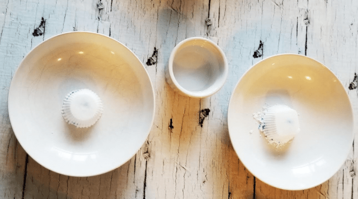 stem for kids shows two white bowls each with a white puck in them.