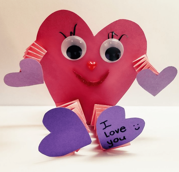 steam activity a construction paper heart face with pop out arms and legs