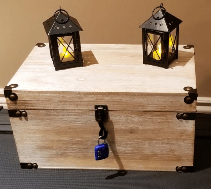 Make your own escape room the image shows a large treasure box with two tea light holders