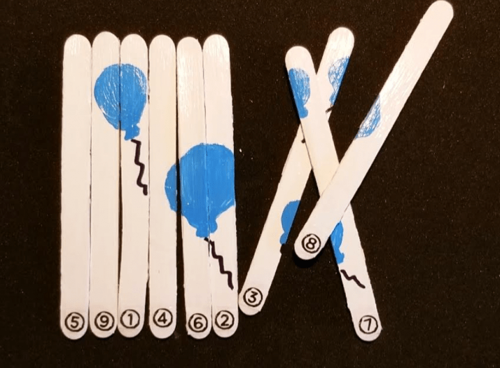 DIY puzzles for kids and 9 popsicle sticks with painted pictures and numbers