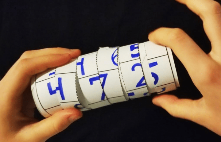 Make your own escape room a child rolls number strips to create three numbers