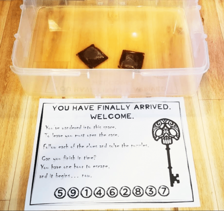 DIY escape room for Kids shows a printed welcome letter and water with tea bags in it.