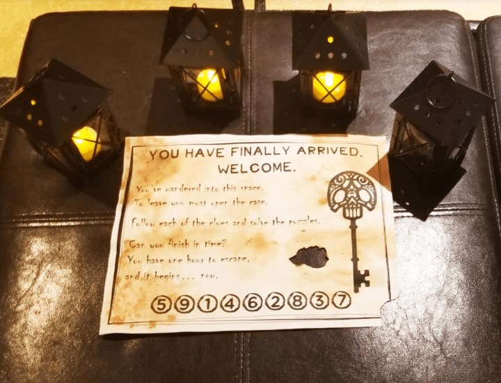Escape room for kids set up with small tea light candle holders and the welcome letter