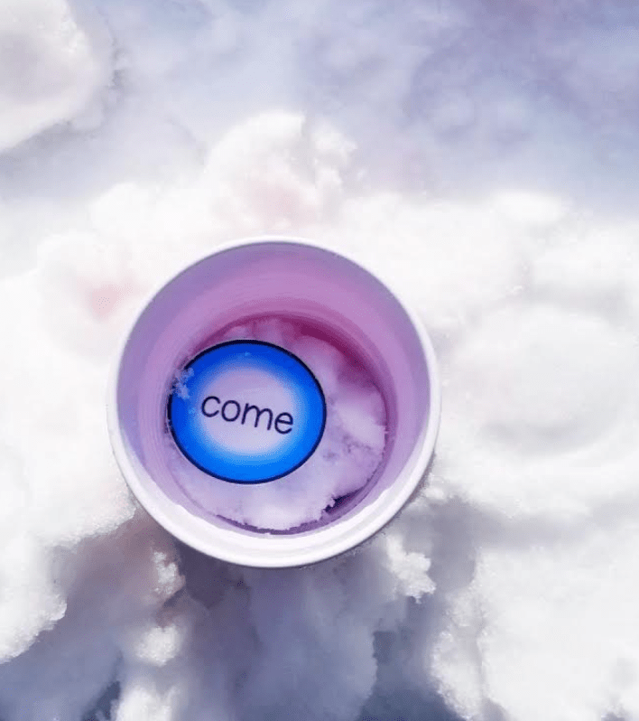 outdoor winter activity shows a cup with snow and a circle page that says come