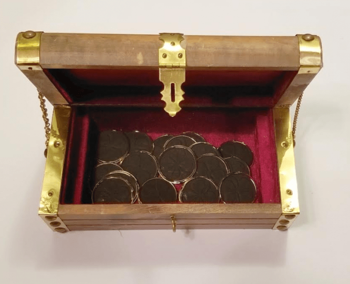 diy escape room picture with a treasure chest filled with coins